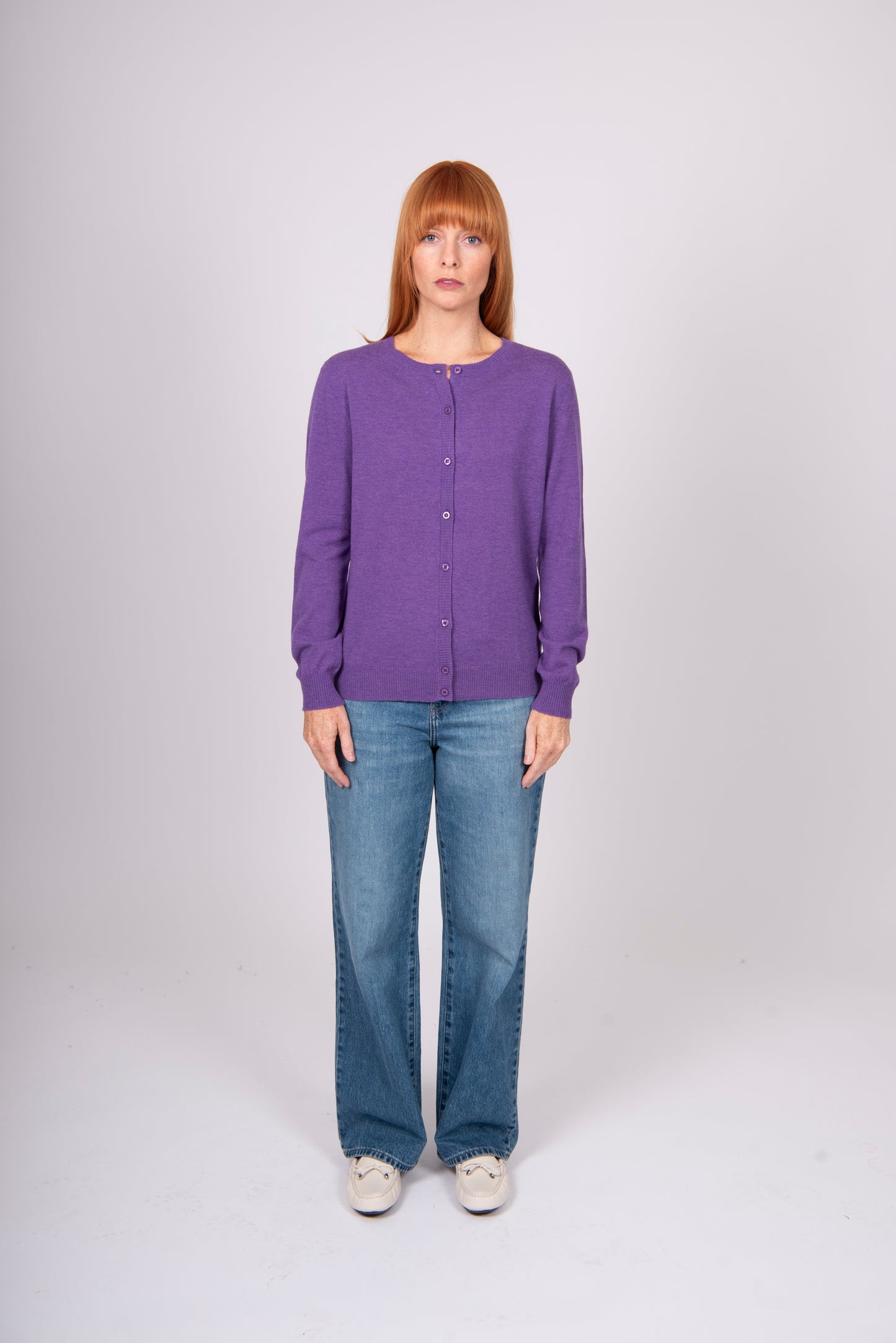 Woman wearing Bridge and Lord's Crew Cardigan in Grape purple