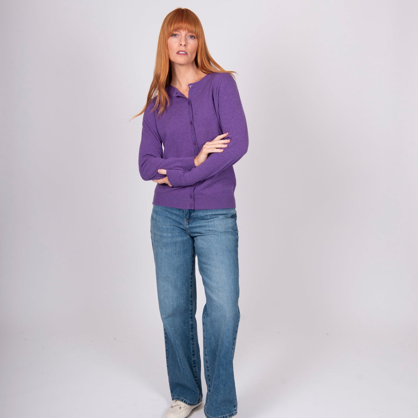 Woman wearing Bridge and Lord's Crew Cardigan in Grape purple