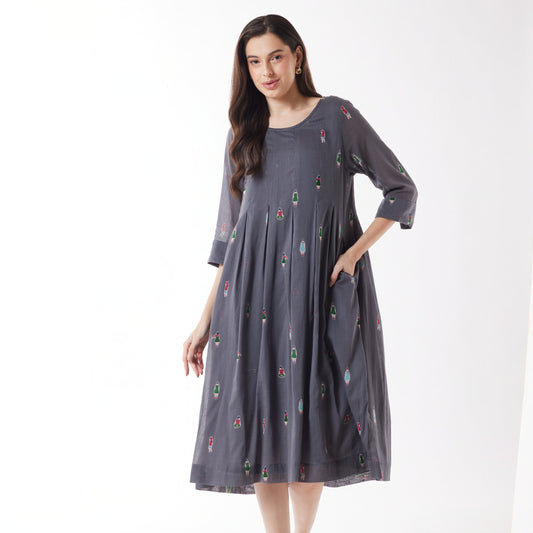 Woman wearing Au Hasard D'Un Voyage's Pleated Round Neck Dress in People grey