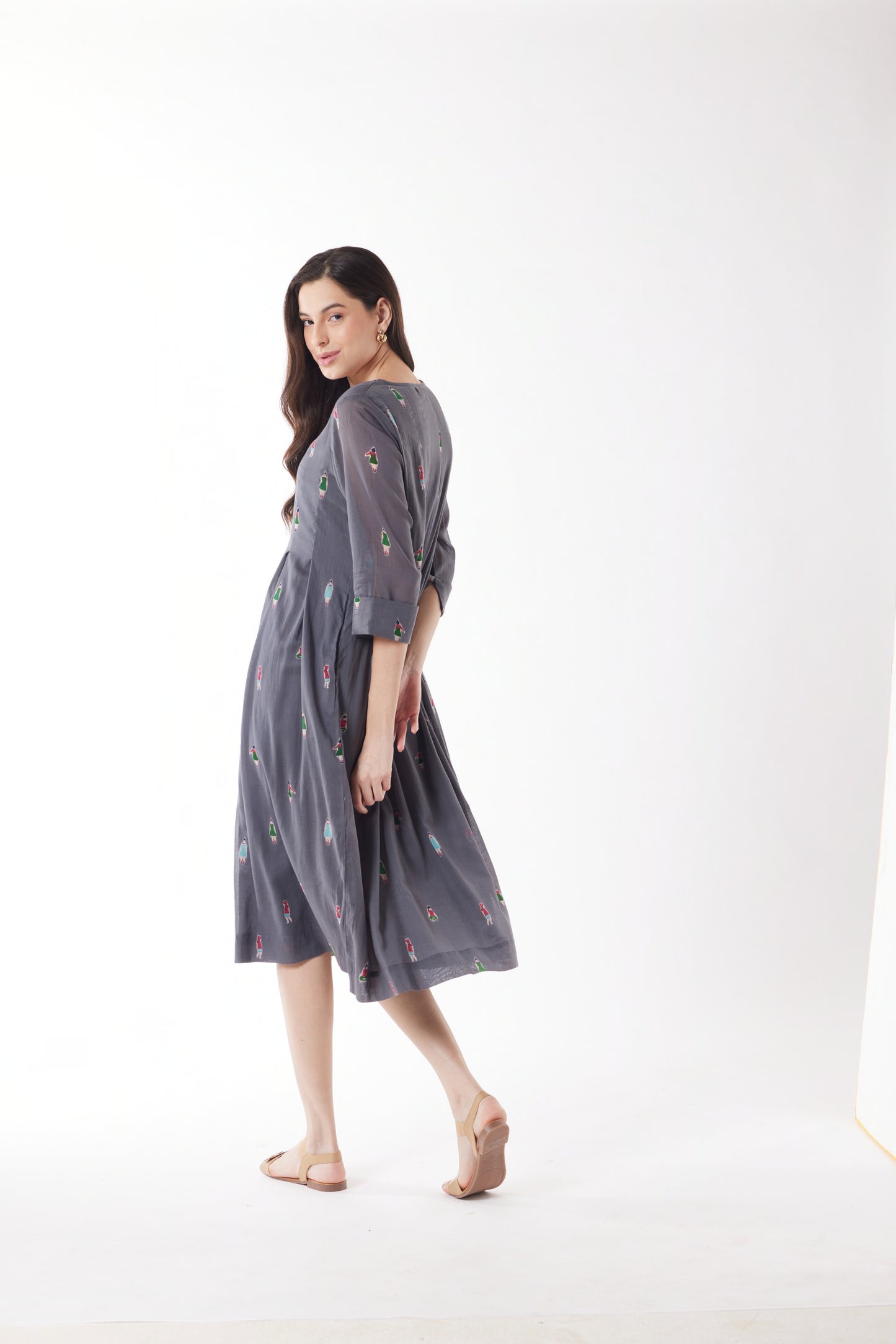 Woman wearing Au Hasard D'Un Voyage's Pleated Round Neck Dress in People grey