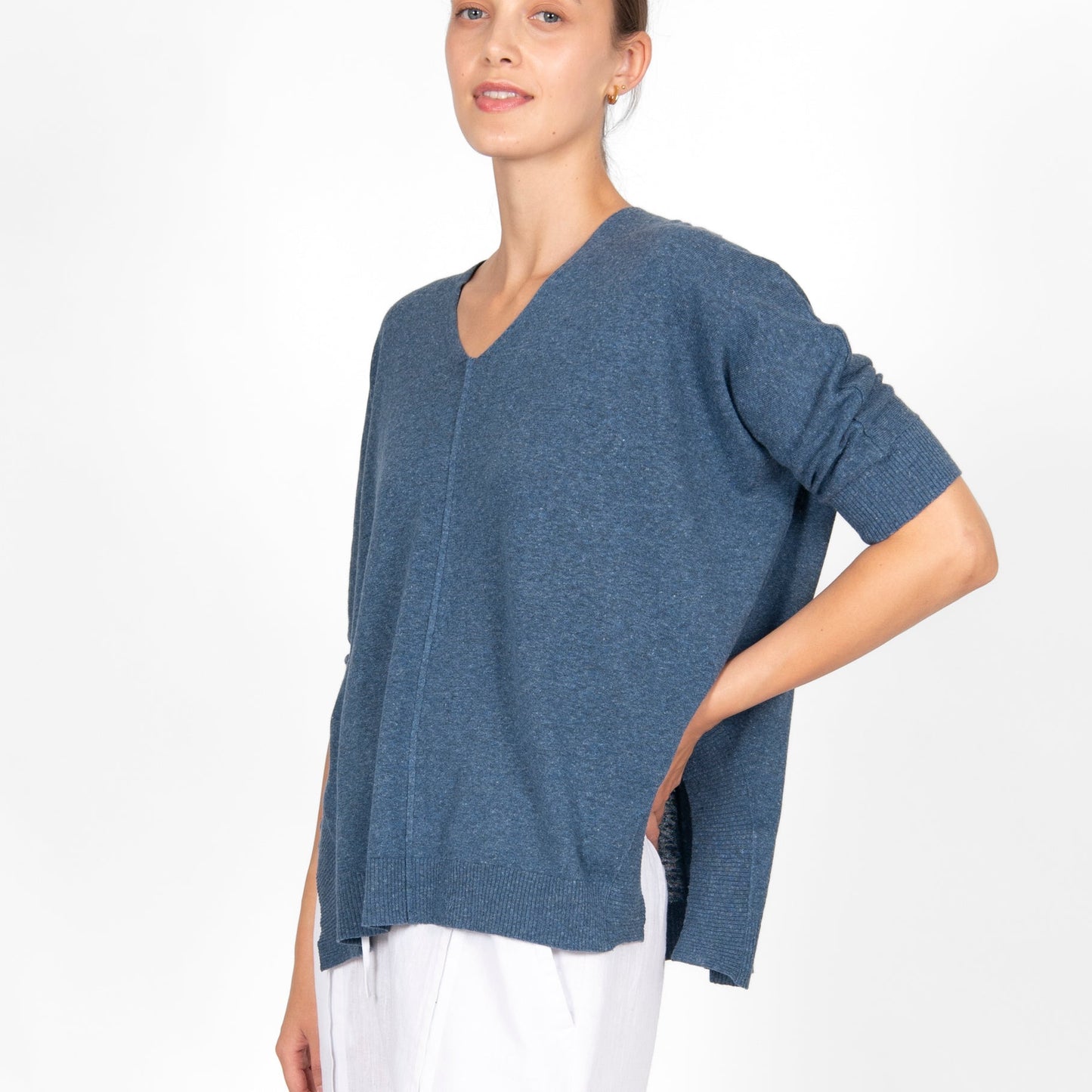 Woman wearing the cotton linen Swing top in Denim blue by Bridge and Lord