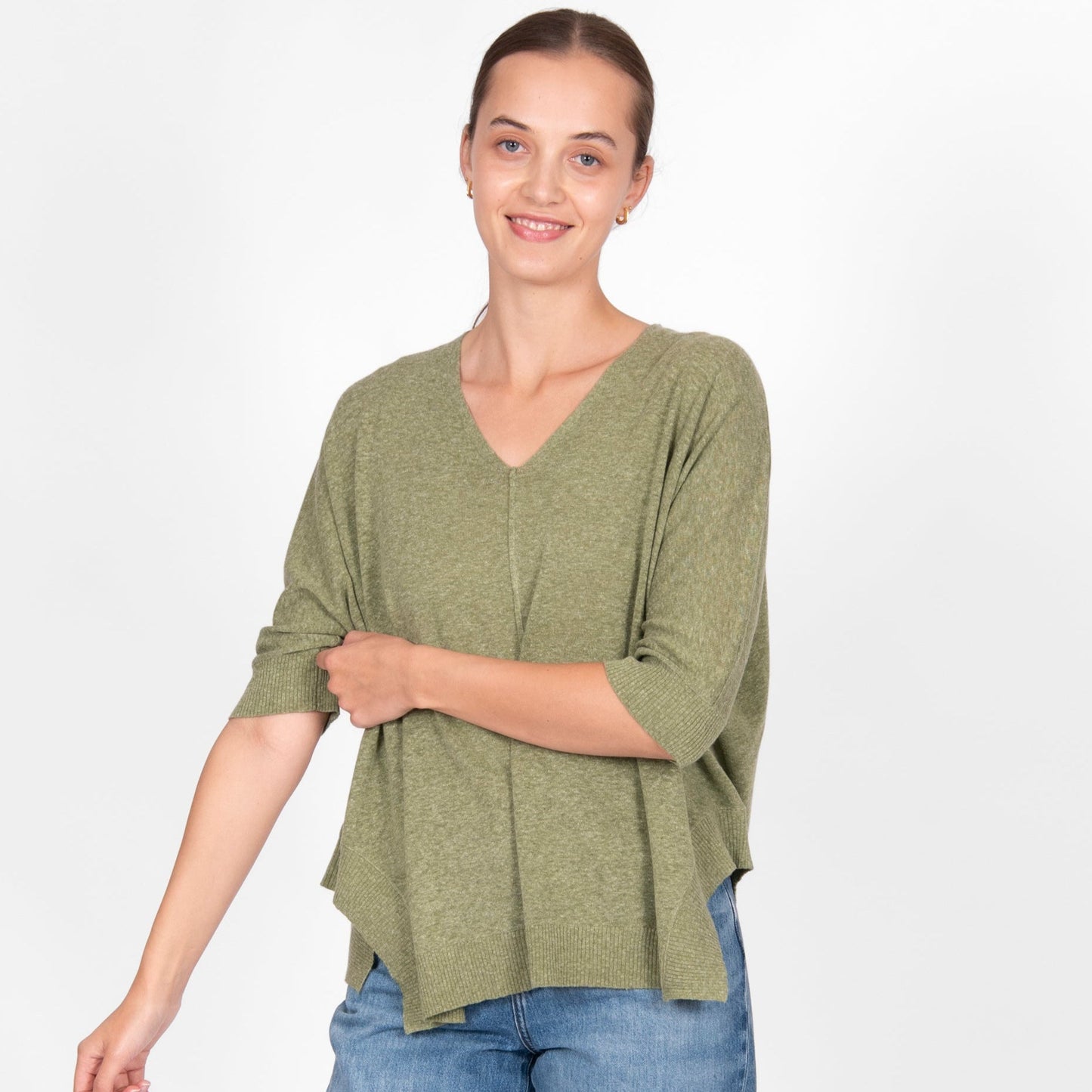 Woman wearing the Bridge and Lord cotton linen swing top in sage green