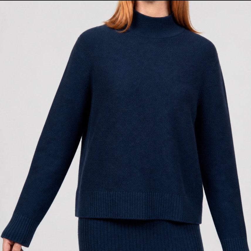 Woman wearing the Links Ribbed navy Pullover by Bridge and Lord in ink
