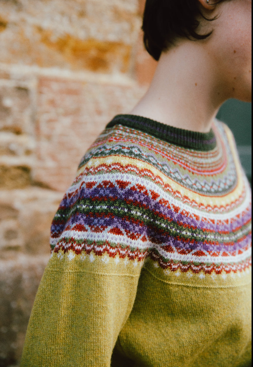 Woman wearing the Eribe Fair Isle Alpine Sweater in Findhorn