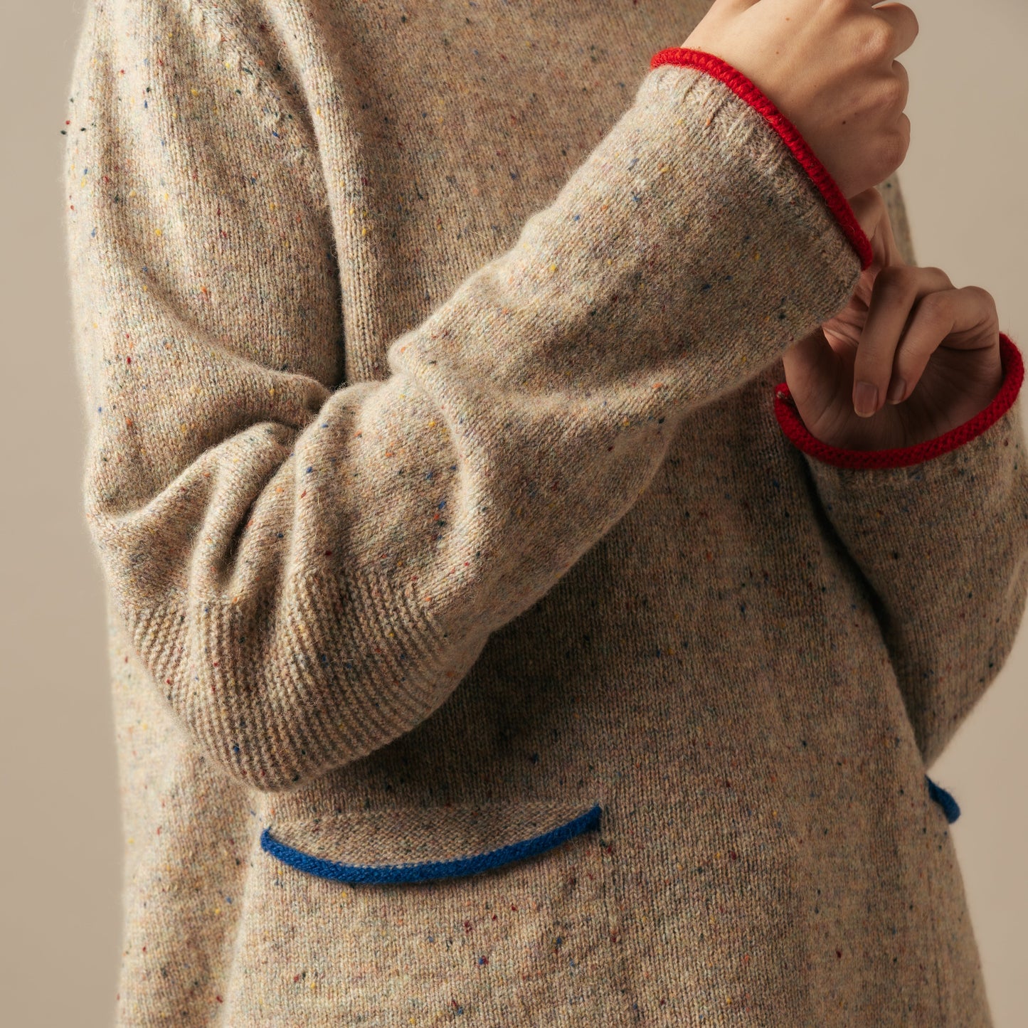 Woman wearing the Tweed Nep Merino Jumper by Eribe in Sand