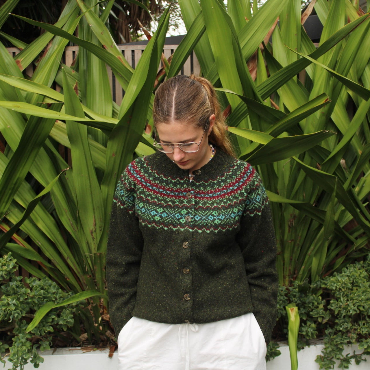 Woman wearing the Chunky wool nep Fairisle Cardigan by Harley of Scotland in Harris green