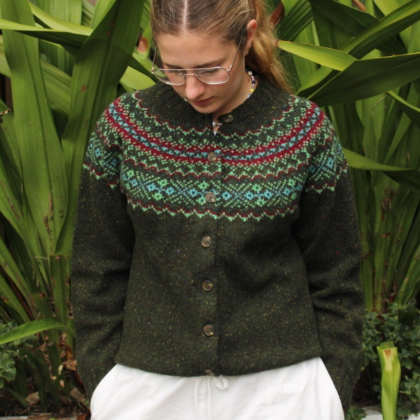 Woman wearing the Chunky wool nep Fairisle Cardigan by Harley of Scotland in Harris green
