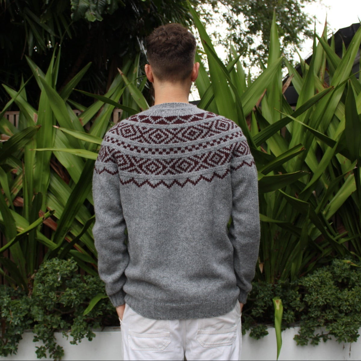 Back view of the men's Shetland wool Fairisle Sweater in grey and beetroot by Harley of Scotland