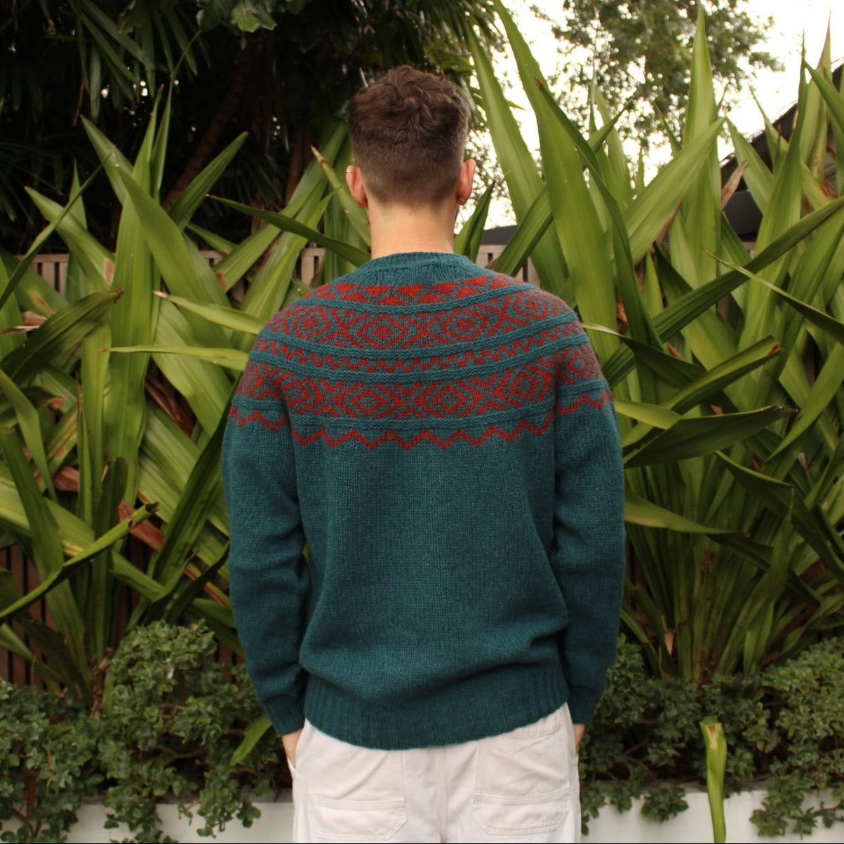 Back view of the men's Shetland wool Fairisle Sweater in Tempest and Madder by Harley of Scotland
