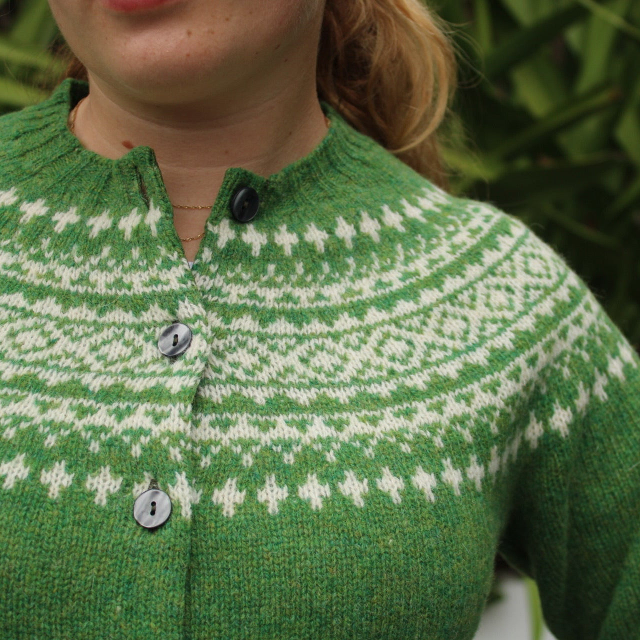 Close up of wool knitted fairisle pattern on yoke of cardigan