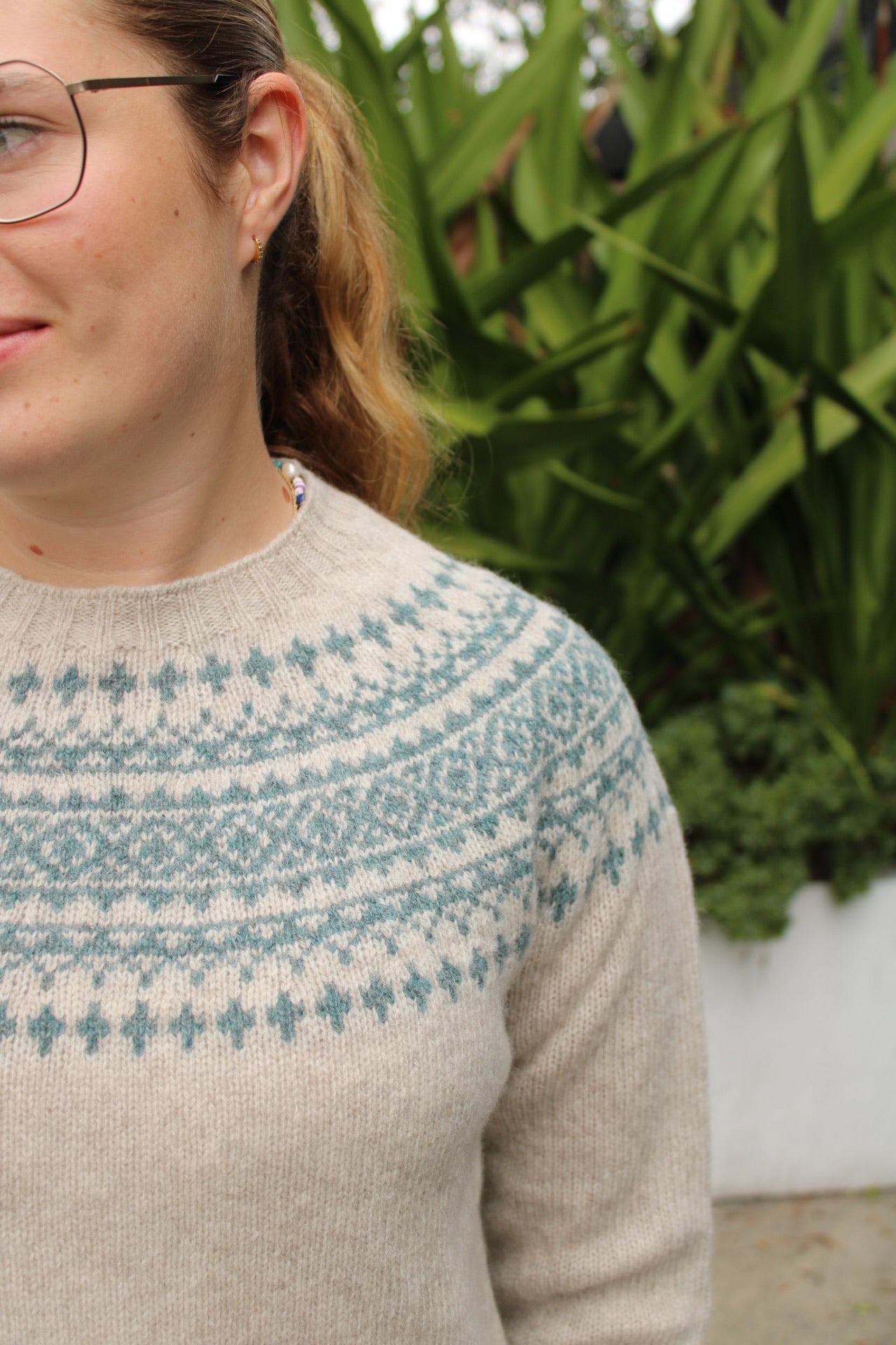 Close up of the Fairisle knitted pattern on the yoke in blue and cream
