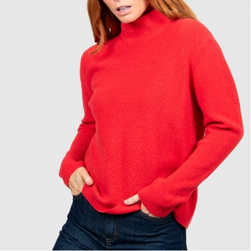 Woman wearing the High Crew Rib Jumper in Cayenne red by Bridge and Lord