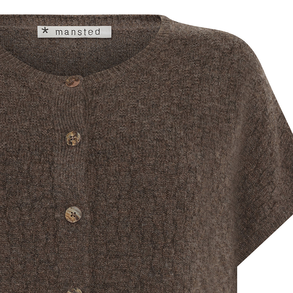 Detail of the lambswool Komma knitted vest in Brown by Mansted