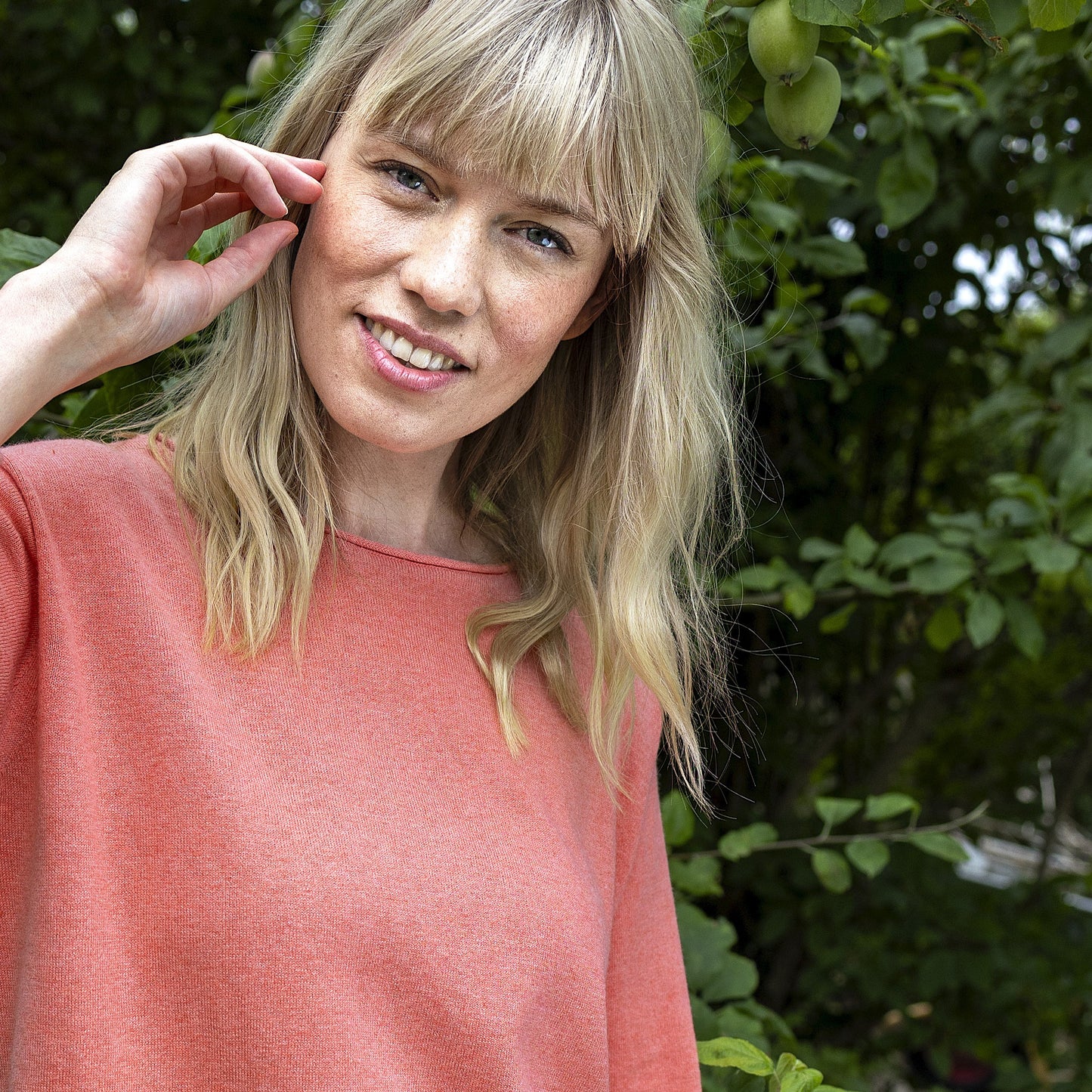 Woman wearing the NOK Oza Top in Light Red by Charlotte Mansted