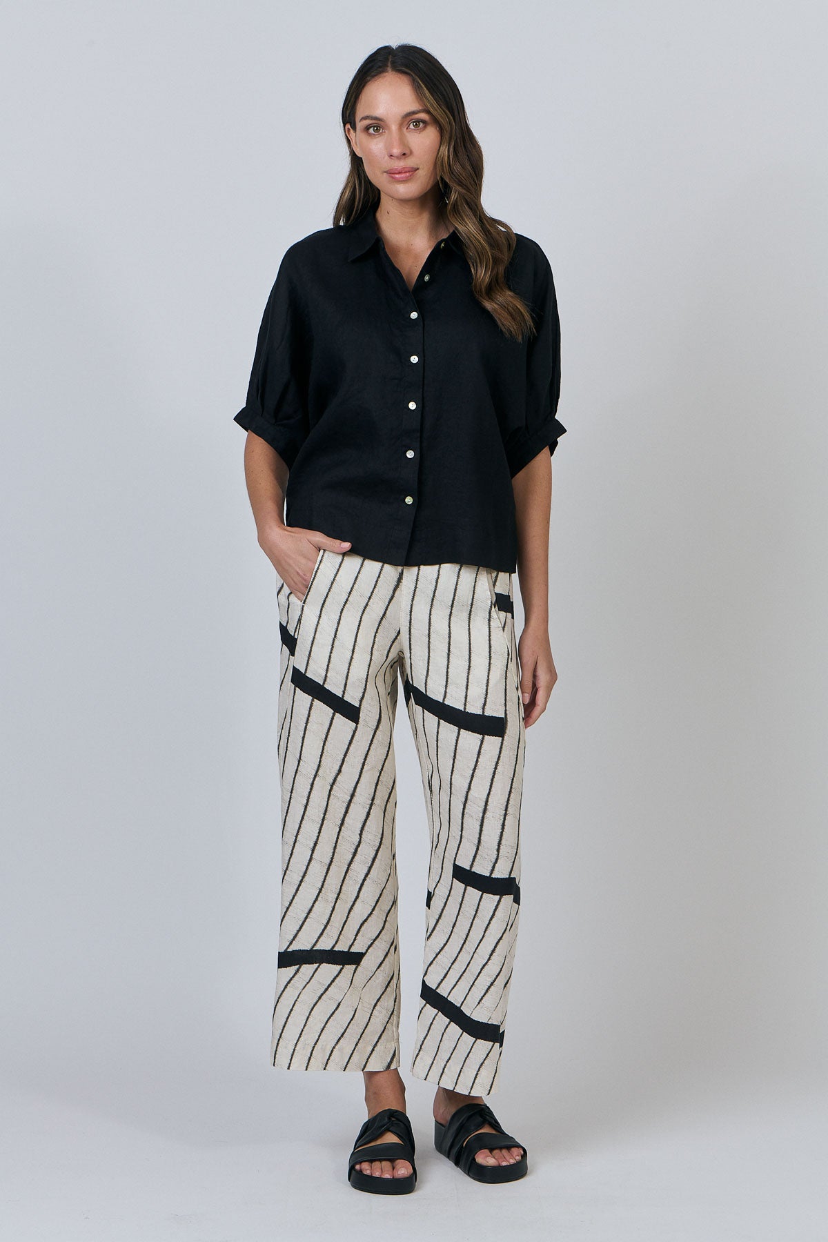 Woman wearing Naturals by O&J's 3/4 Sleeve Shirt in Black Linen