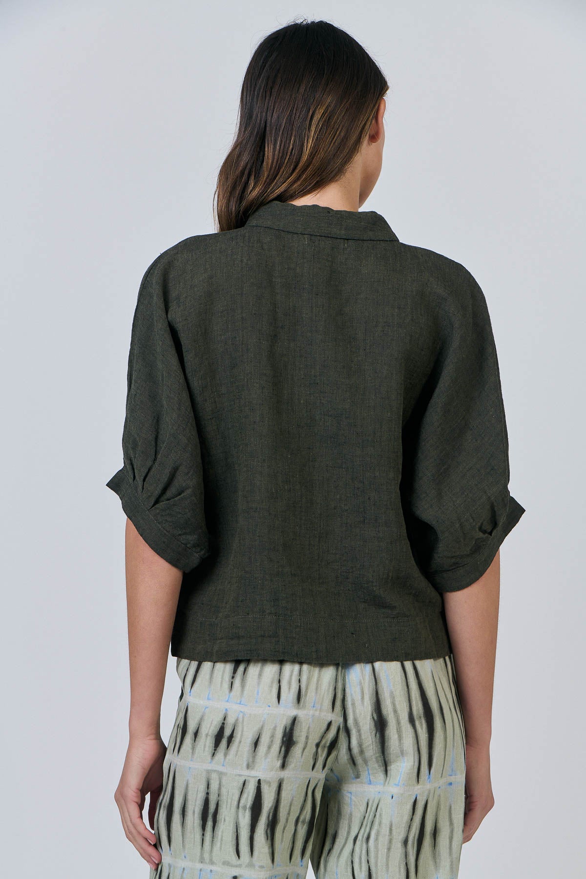 Woman wearing Naturals by O&J's 3/4 Sleeve Linen Shirt in Licorice