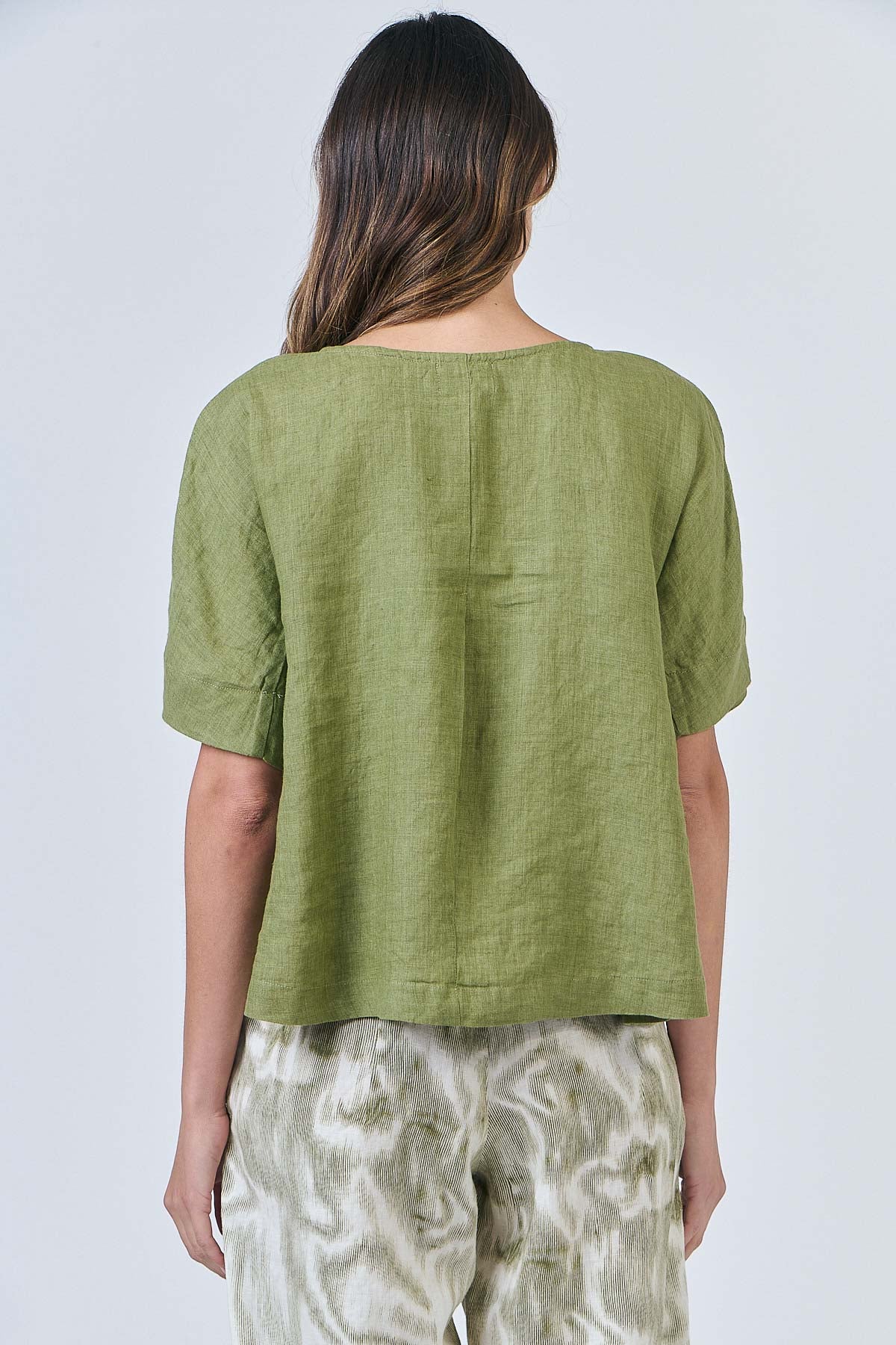 Woman wearing Naturals by O&J's Simple Linen Top in Moss green
