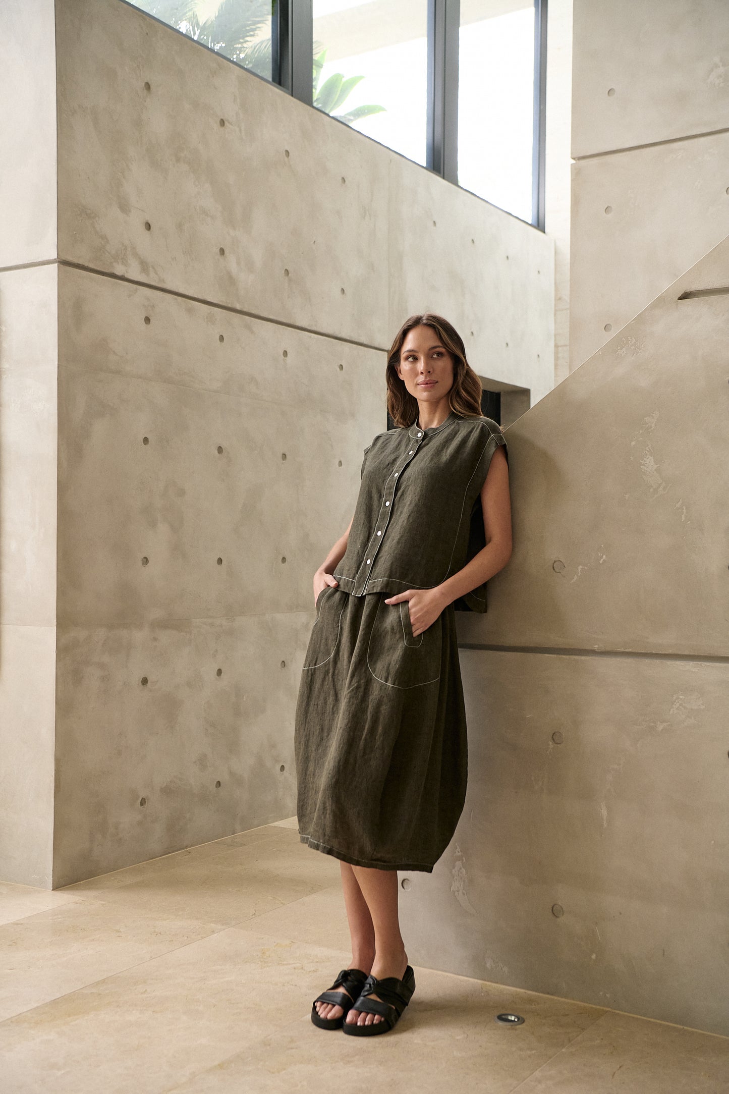 Woman wearing Naturals by O&J's Skirt in Licorice olive