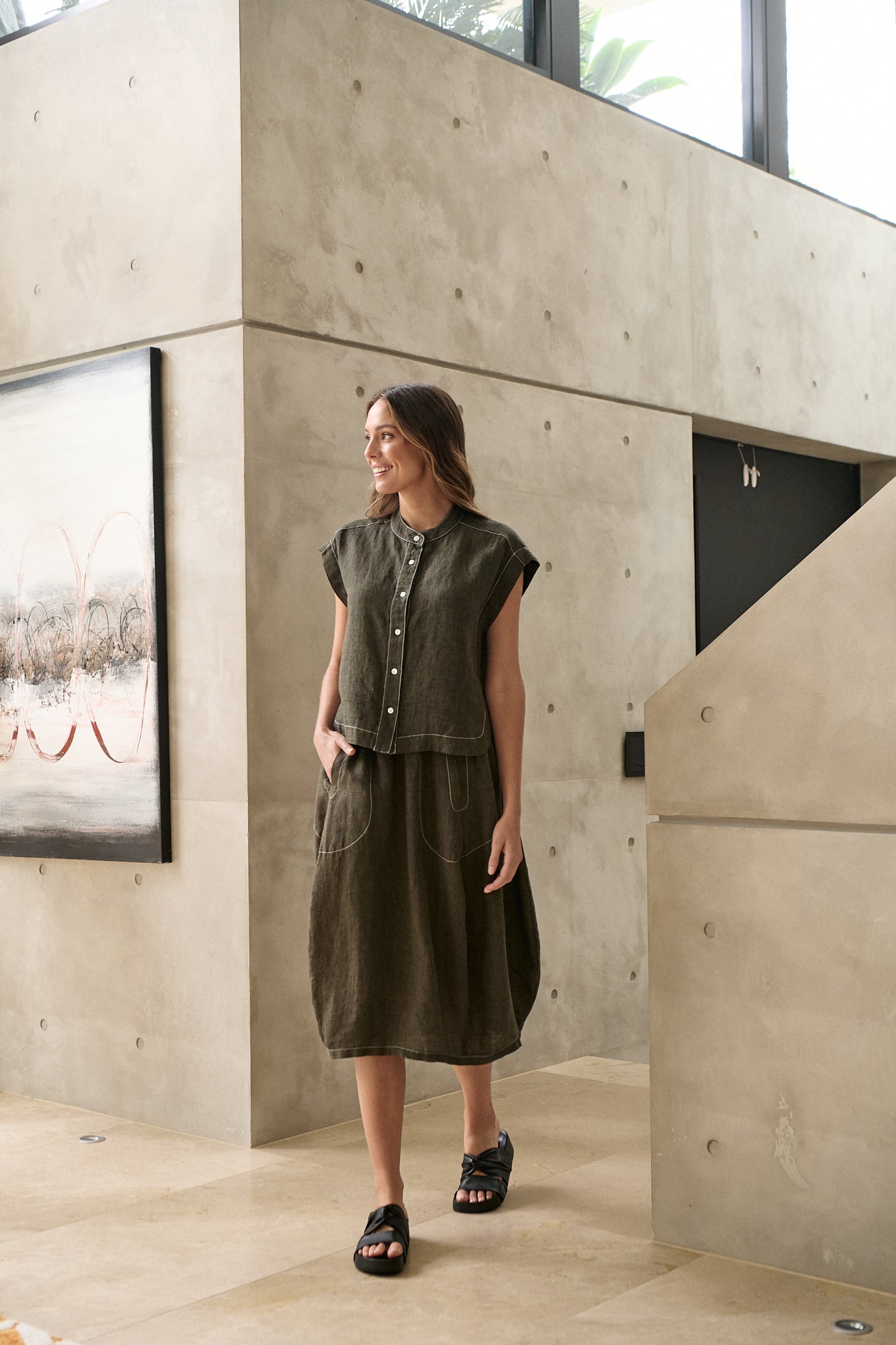 Woman wearing Naturals by O&J's Skirt in Licorice olive