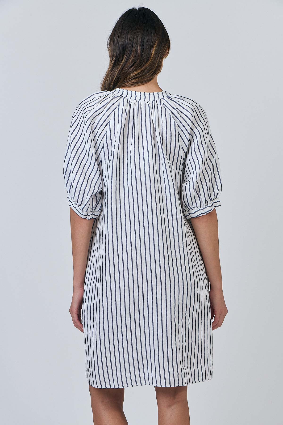 Woman wearing the Naturals by O&J's Striped Linen Dress in Blueberry