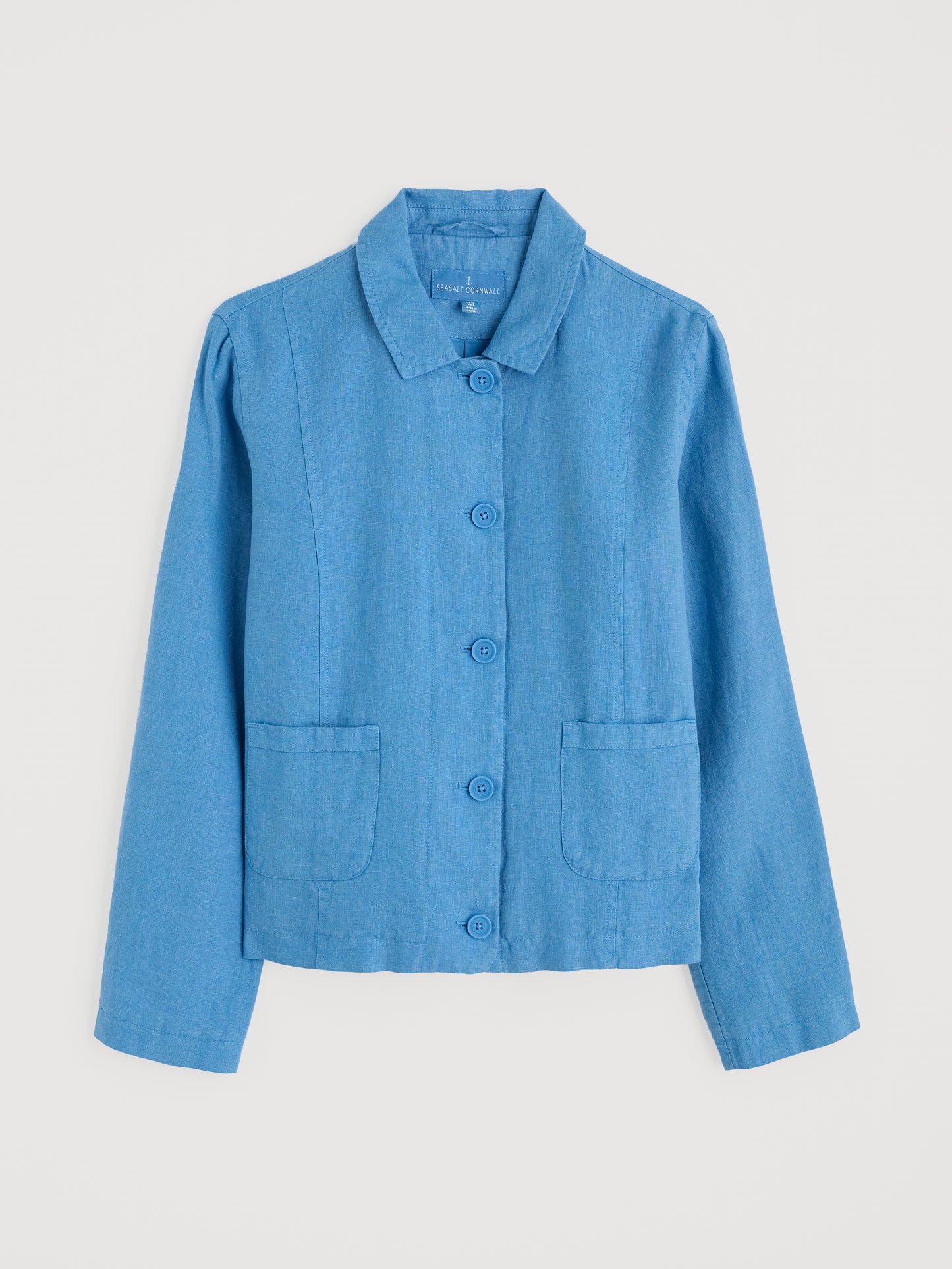 Flat lay of the Arame Linen Jacket by SEASALT for women in Clear Sky