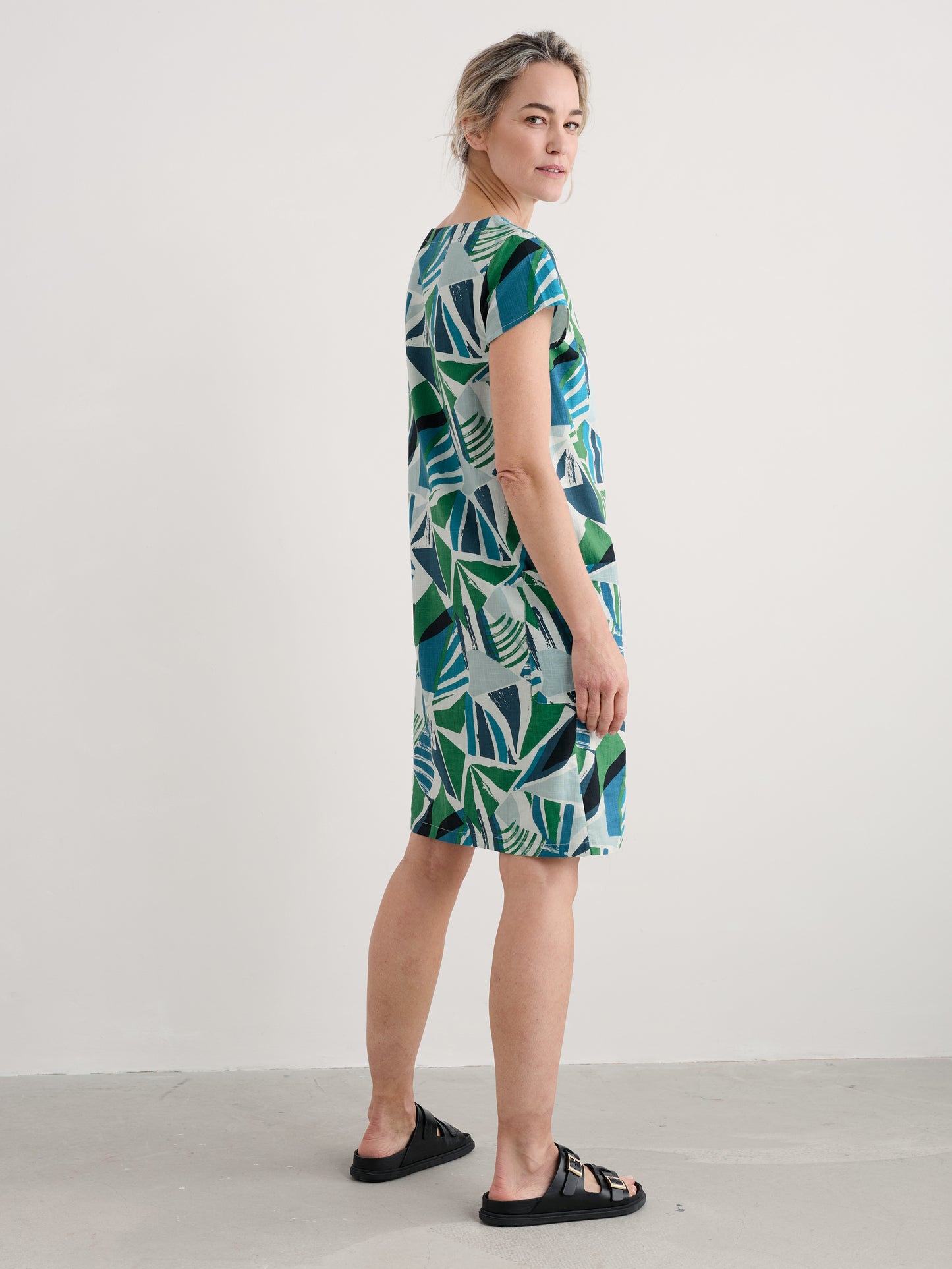 Woman wearing the River Cover cotton shift Dress by SEASALT in Spinnaker Sails Hedgerow