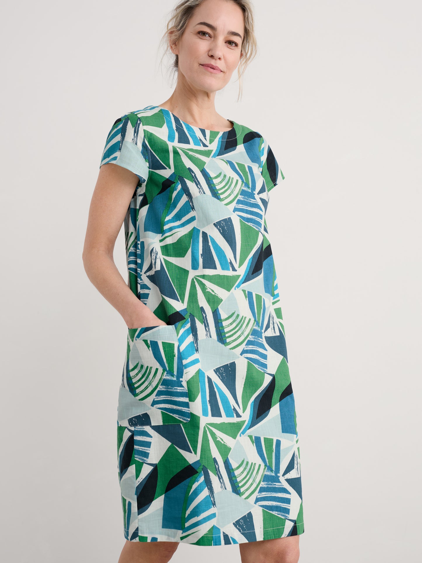 Woman wearing the River Cover cotton shift Dress by SEASALT in Spinnaker Sails Hedgerow