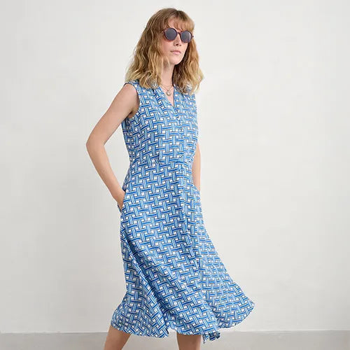 Woman wearing the SEASALT Carved Wood Sleeveless cotton Dress in Deck Weave Cargo print