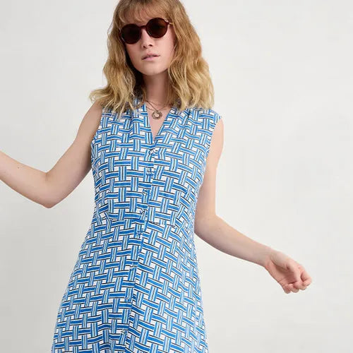 Woman wearing the SEASALT Carved Wood Sleeveless cotton Dress in Deck Weave Cargo print