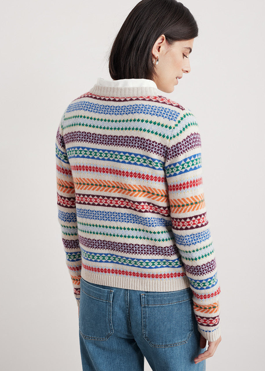 Woman wearing the Percella Cove wool cardigan by SEASALT in Abstraction Multi fair isle