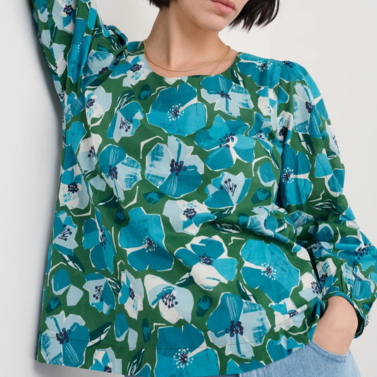Woman wearing the Quill Top in Paper Hellebores Forest green by SEASALT