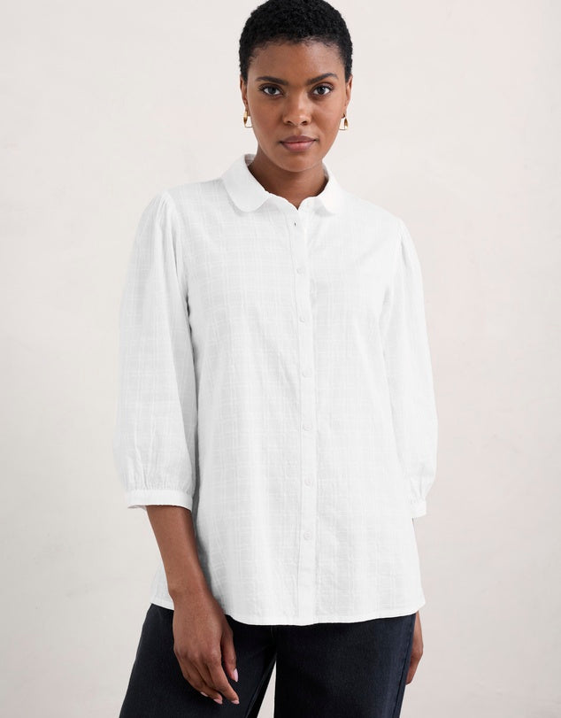 Woman wearing the Hope Cottage Blouse in Salt by SEASALT