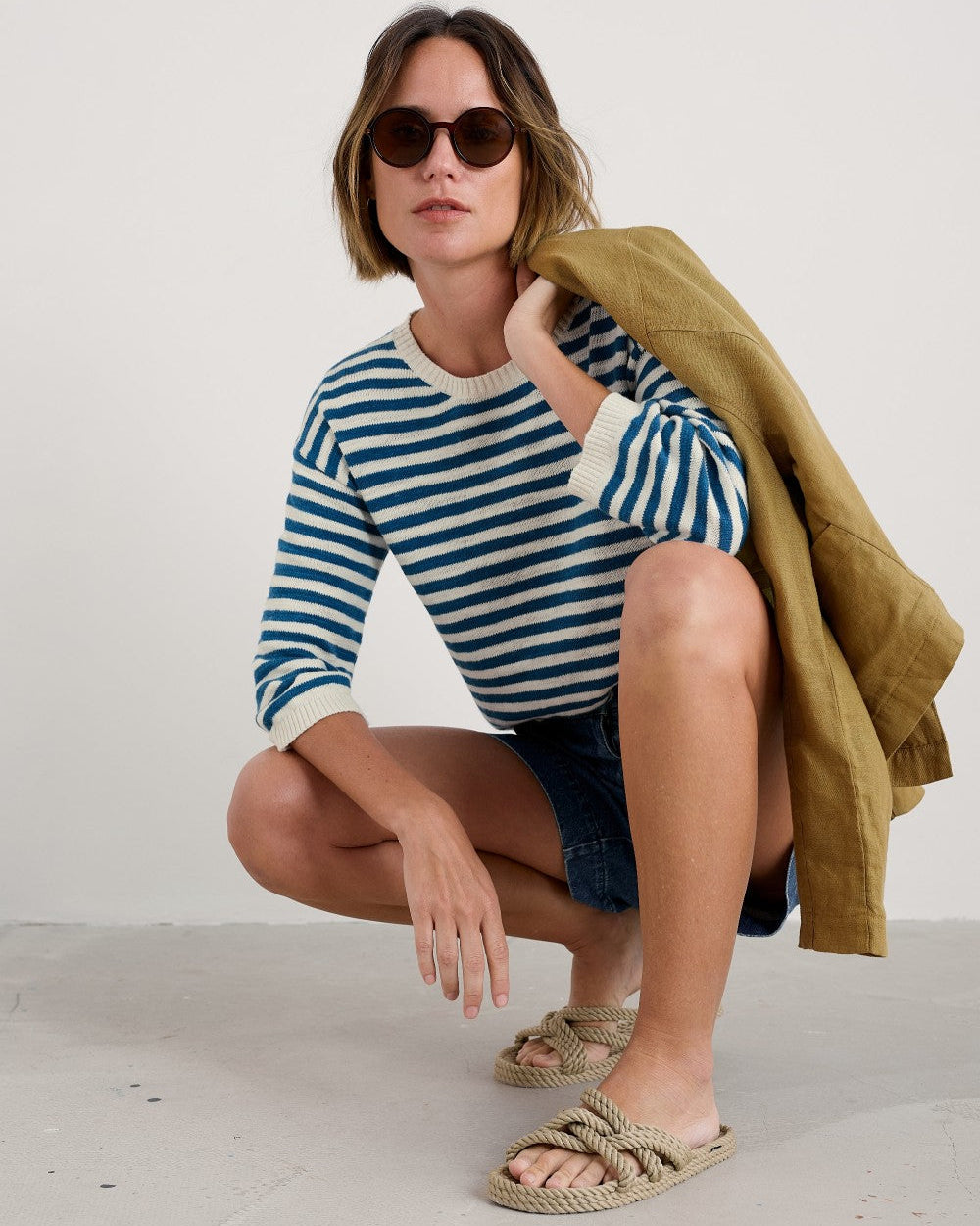 Woman wearing the Knavock Striped cotton Jumper by SEASALT in Mini Cornish Sailor Ecru Blue