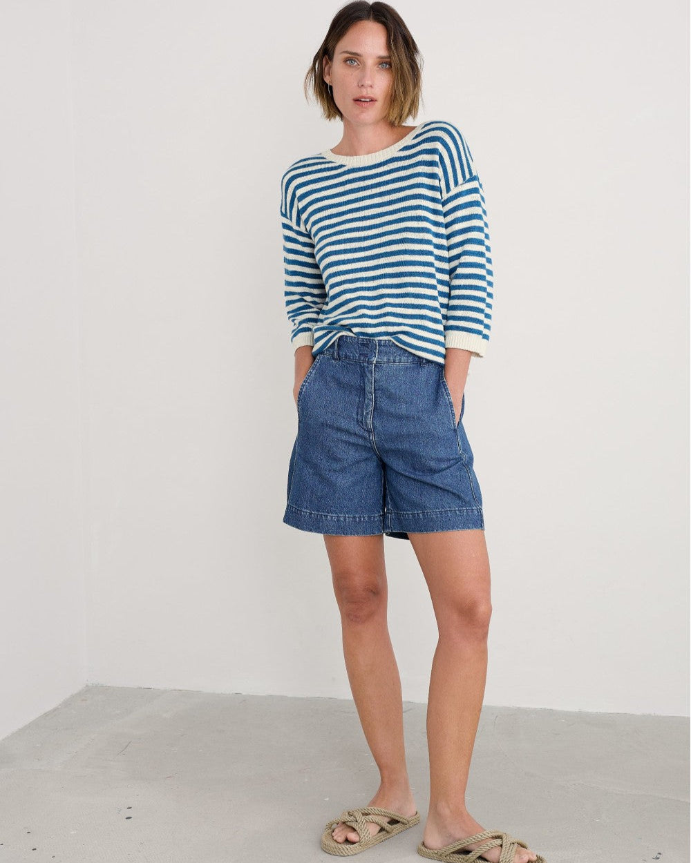 Woman wearing the Knavock Striped cotton Jumper by SEASALT in Mini Cornish Sailor Ecru Blue