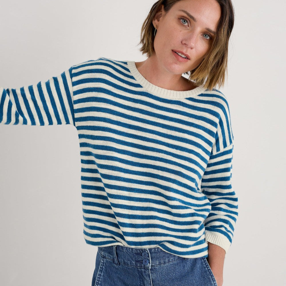 Woman wearing the Knavock Striped cotton Jumper by SEASALT in Mini Cornish Sailor Ecru Blue