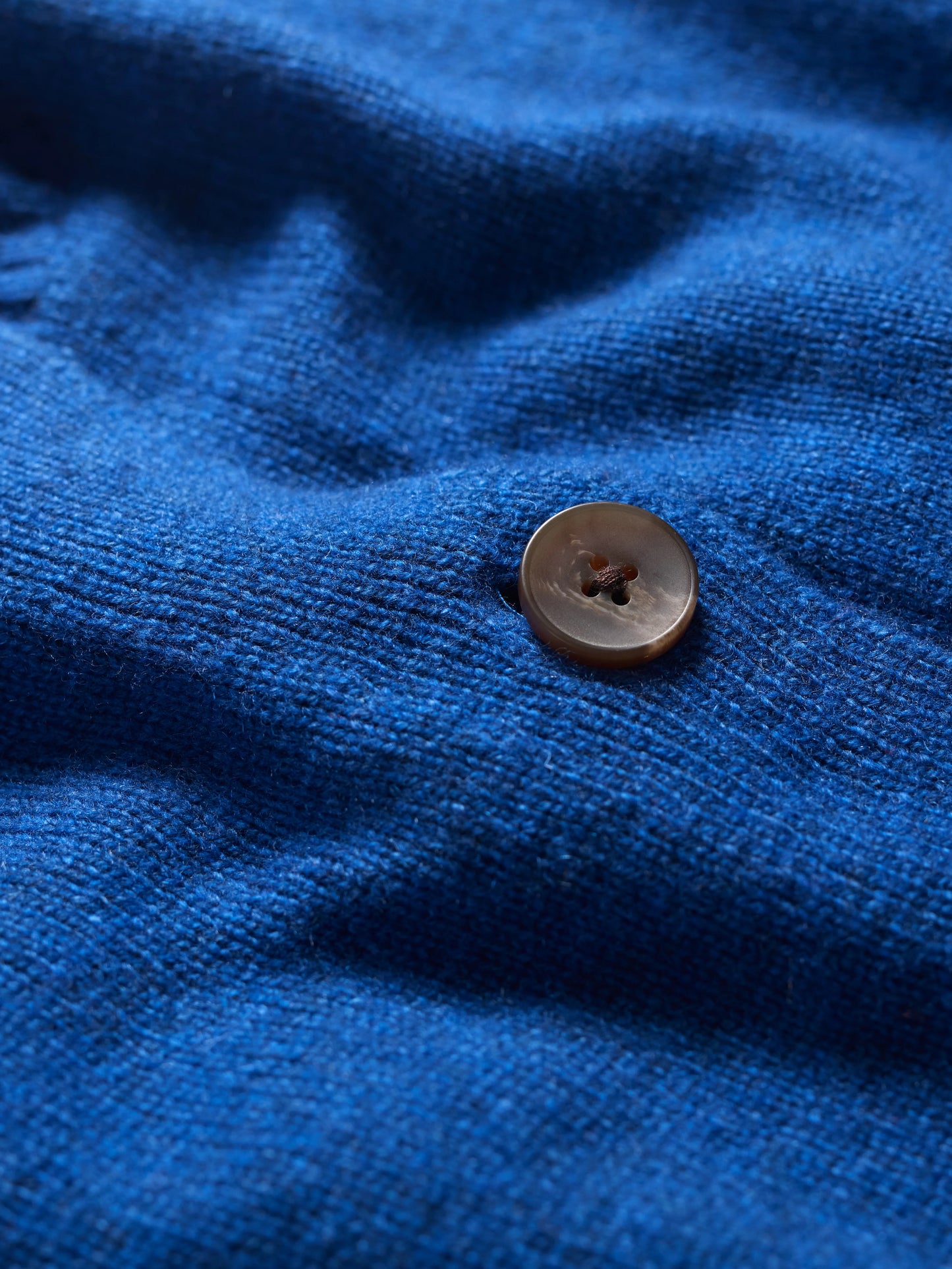 Close up of the knit of the Tern Tide Cardigan in Ink blue by SEASALT