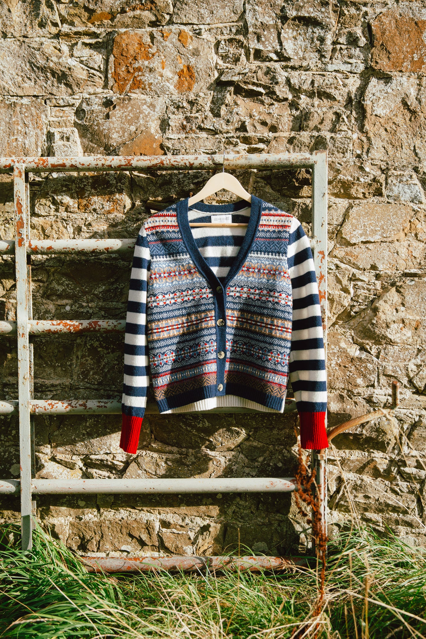 Eribé's Stobo Fair Isle Vee Neck Cardigan in Navy Reflection, cardi hanging