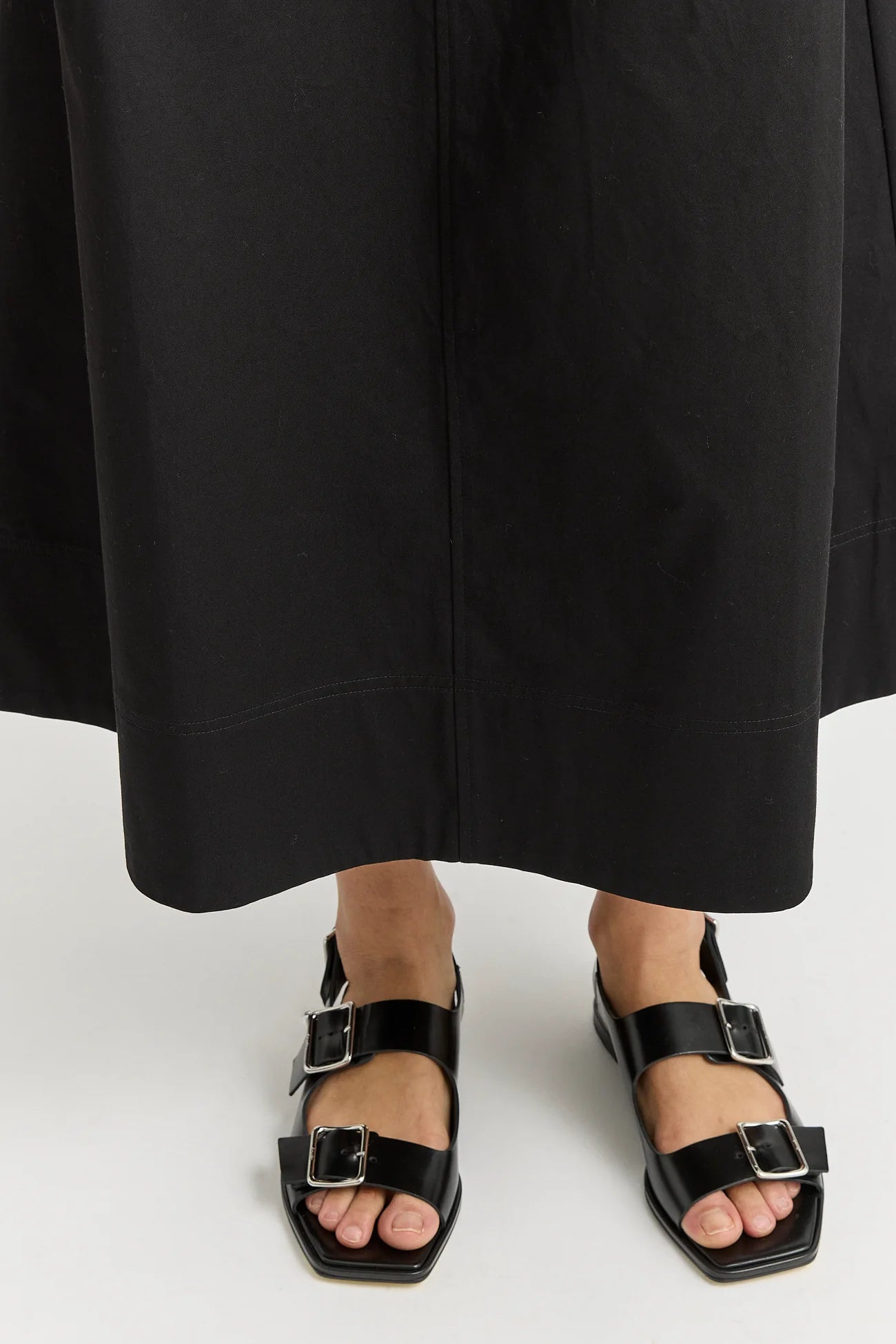 Woman wearing Toorallie's Pleat Detail cotton midi skirt in black