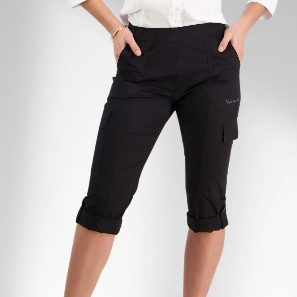 Woman wearing pull on cargo pants in black by vassalli capri length