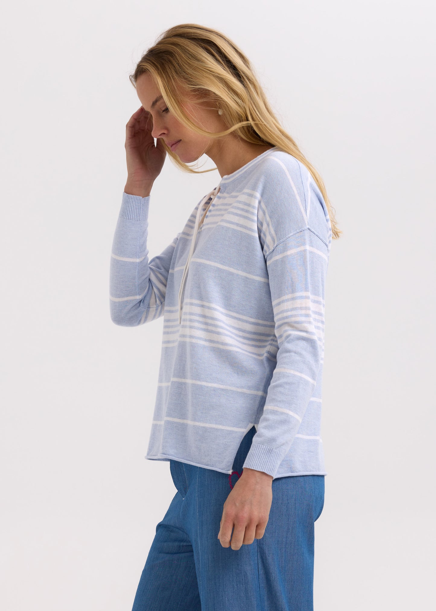 Woman wearing the Beach Bum Jumper by Zaket and Plover in Powder blue