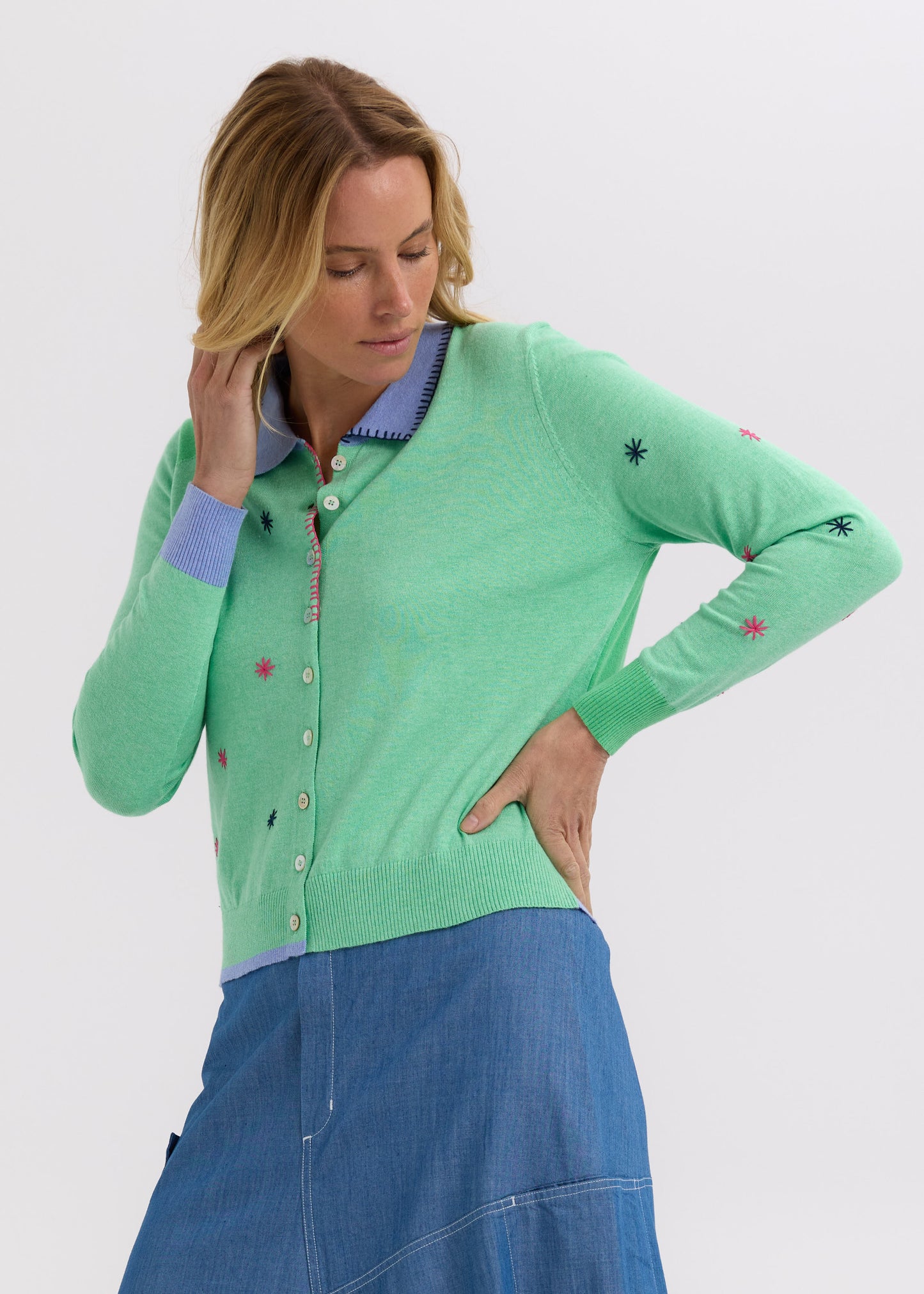 Woman wearing the Blossoms Hand-Work Cardigan by Zaket and Plover in Spearmint green