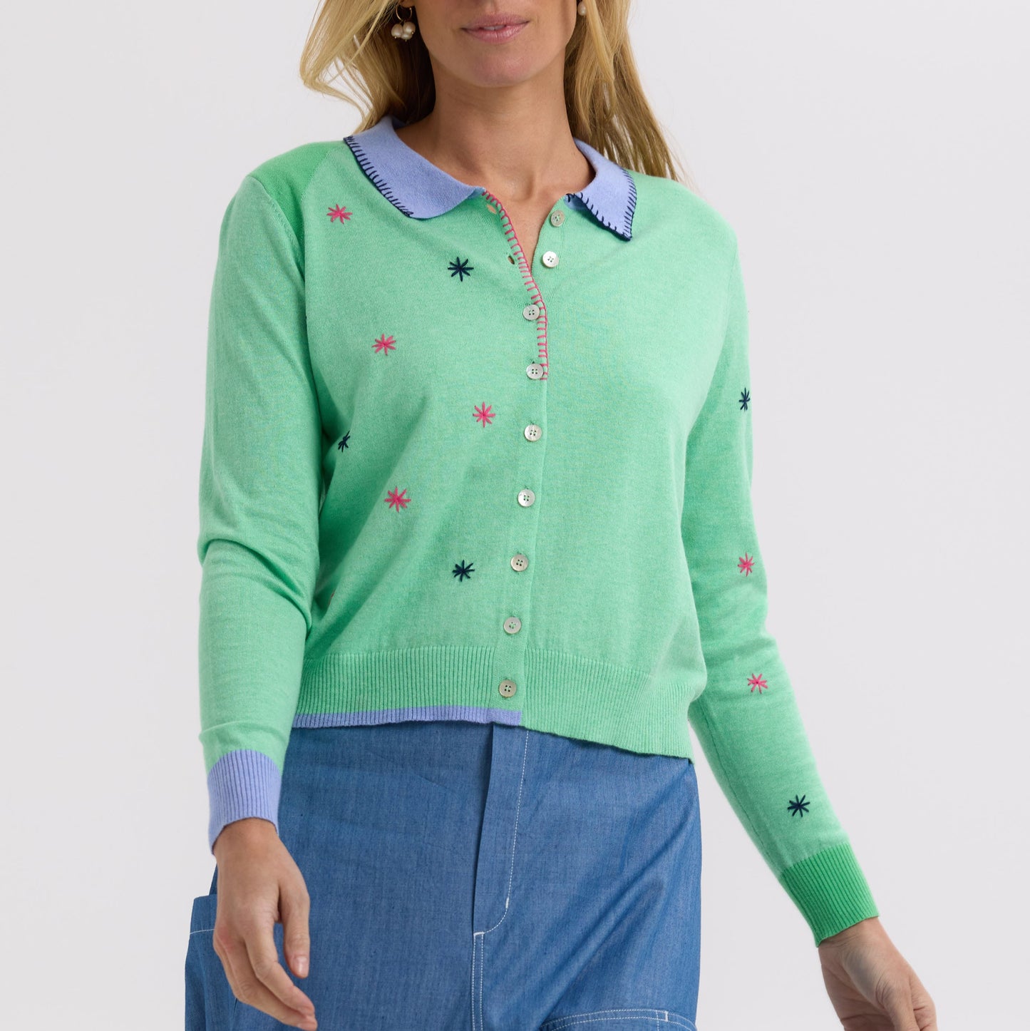 Woman wearing the Blossoms Hand-Work Cardigan by Zaket and Plover in Spearmint green