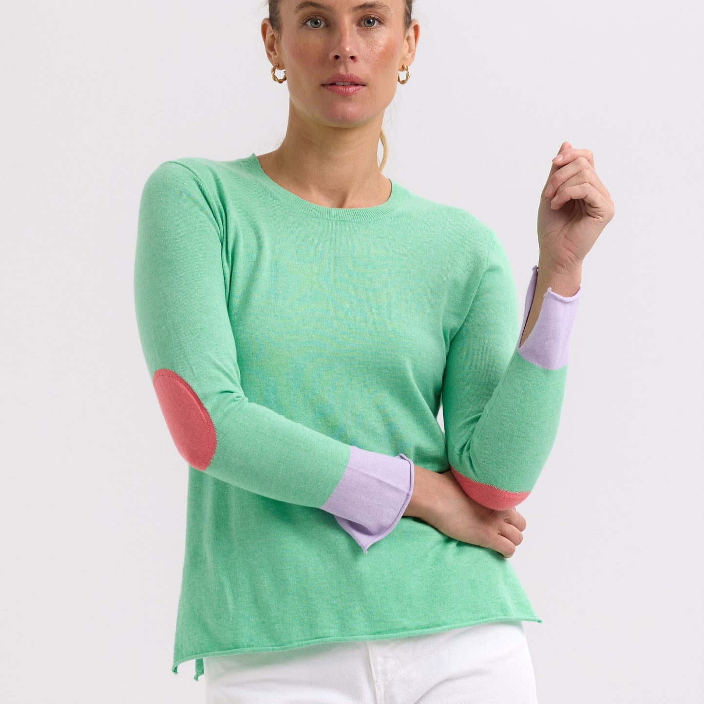 Woman wearing the Elbow Patch Jumper by Zaket and Plover in Spearmint green