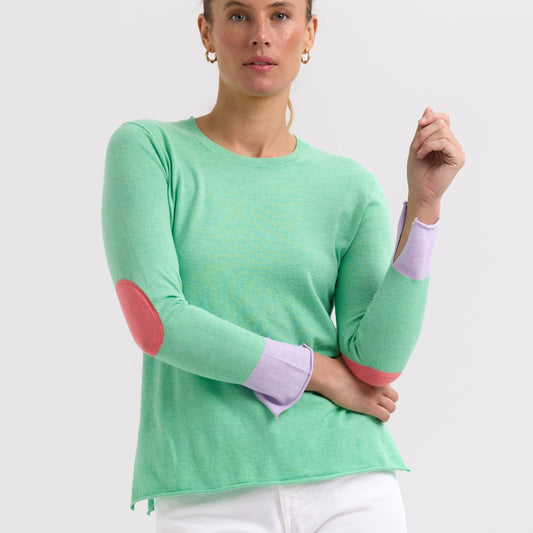 Woman wearing the Elbow Patch Jumper by Zaket and Plover in Spearmint green