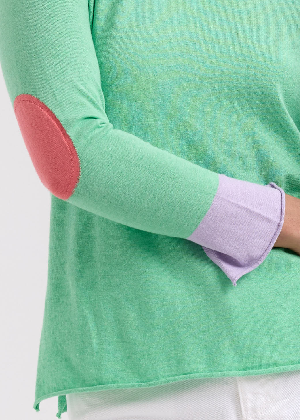 Woman wearing the Elbow Patch Jumper by Zaket and Plover in Spearmint green