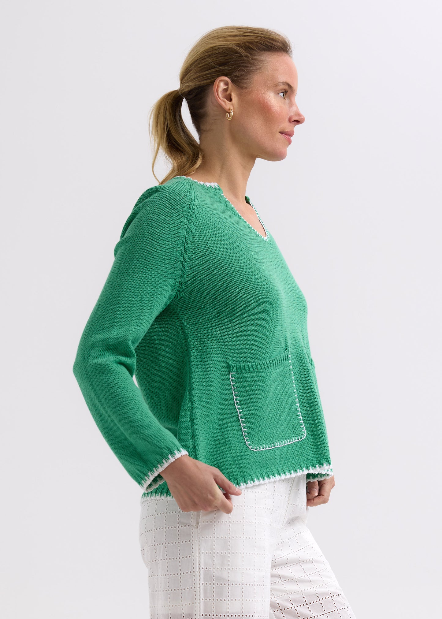 Woman wearing the Hand Work Trim Sweater in green Apple by Zaket and Plover
