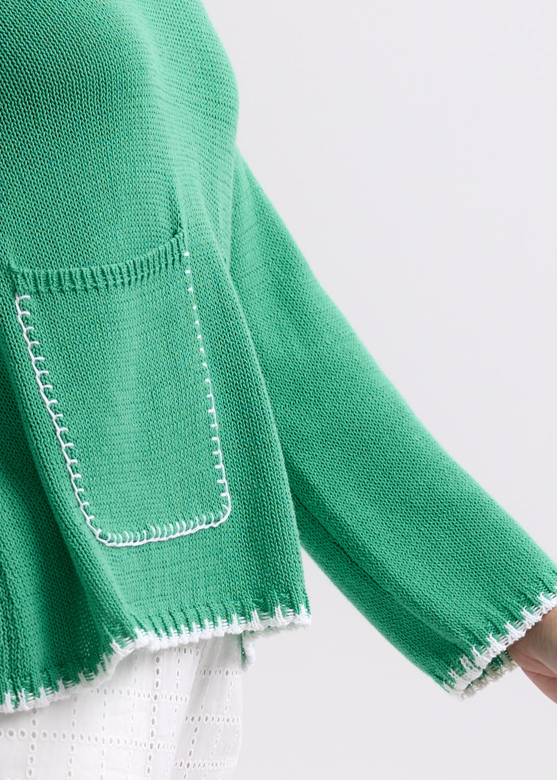 Woman wearing the Hand Work Trim Sweater in green Apple by Zaket and Plover