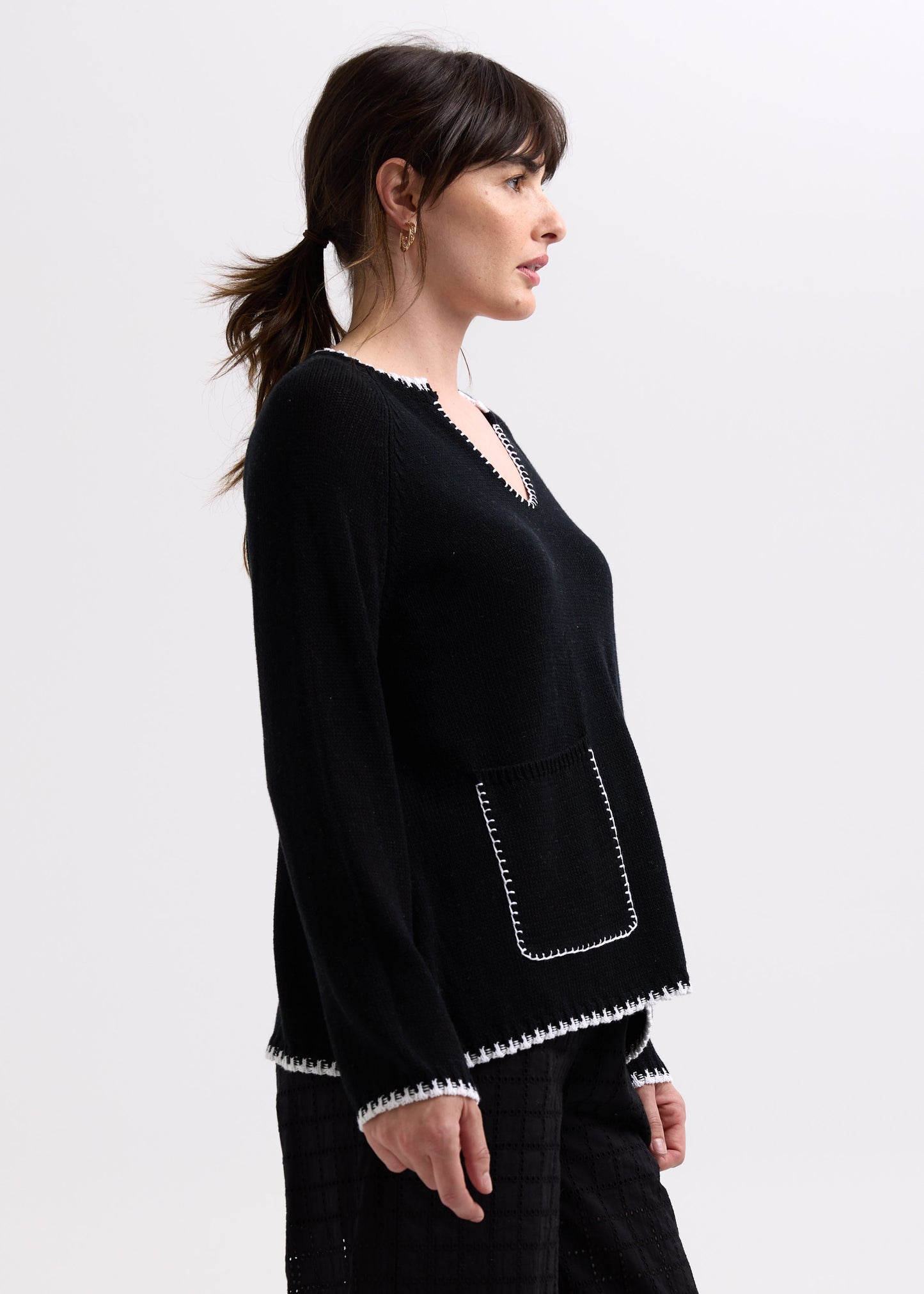 Woman wearing the Hand Work Trim Sweater in Black by Zaket and Plover
