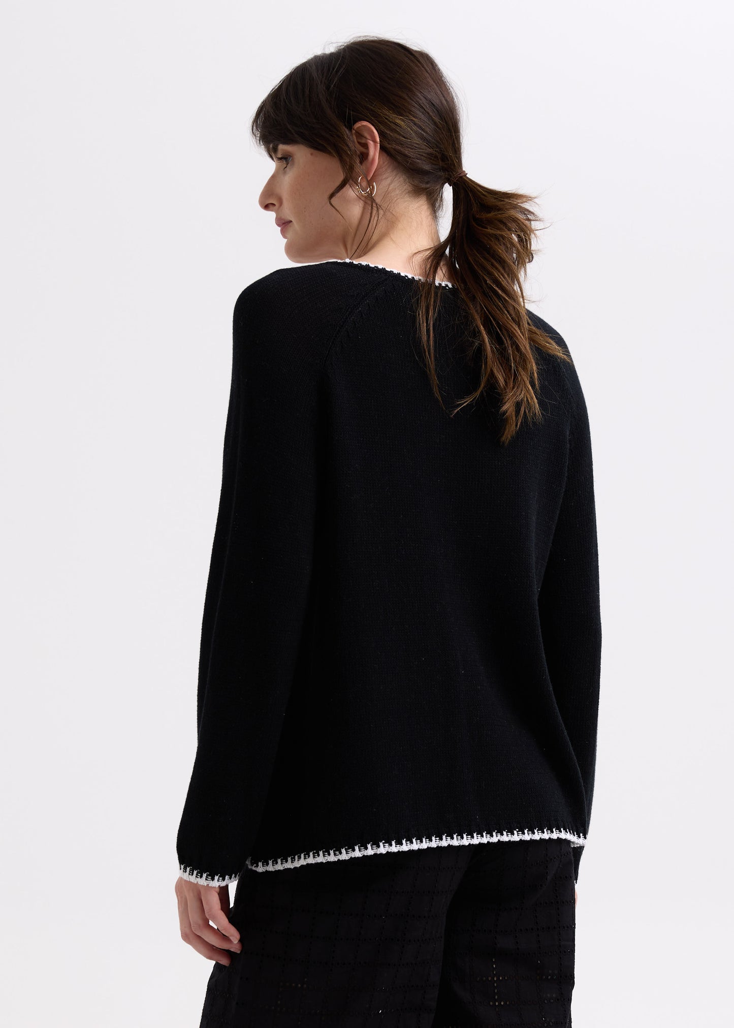 Woman wearing the Hand Work Trim Sweater in Black by Zaket and Plover
