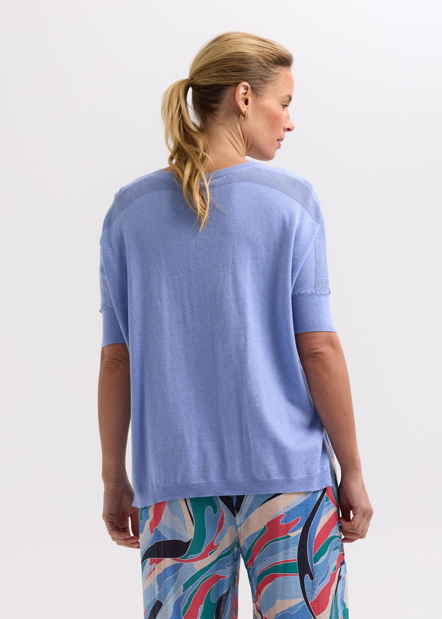 Woman wearing the Pointelle Shoulder Top in Blueberry by Zaket and Plover